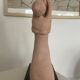 Terracotta sculpture of an entwined couple.