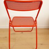 Perforated metal folding chair