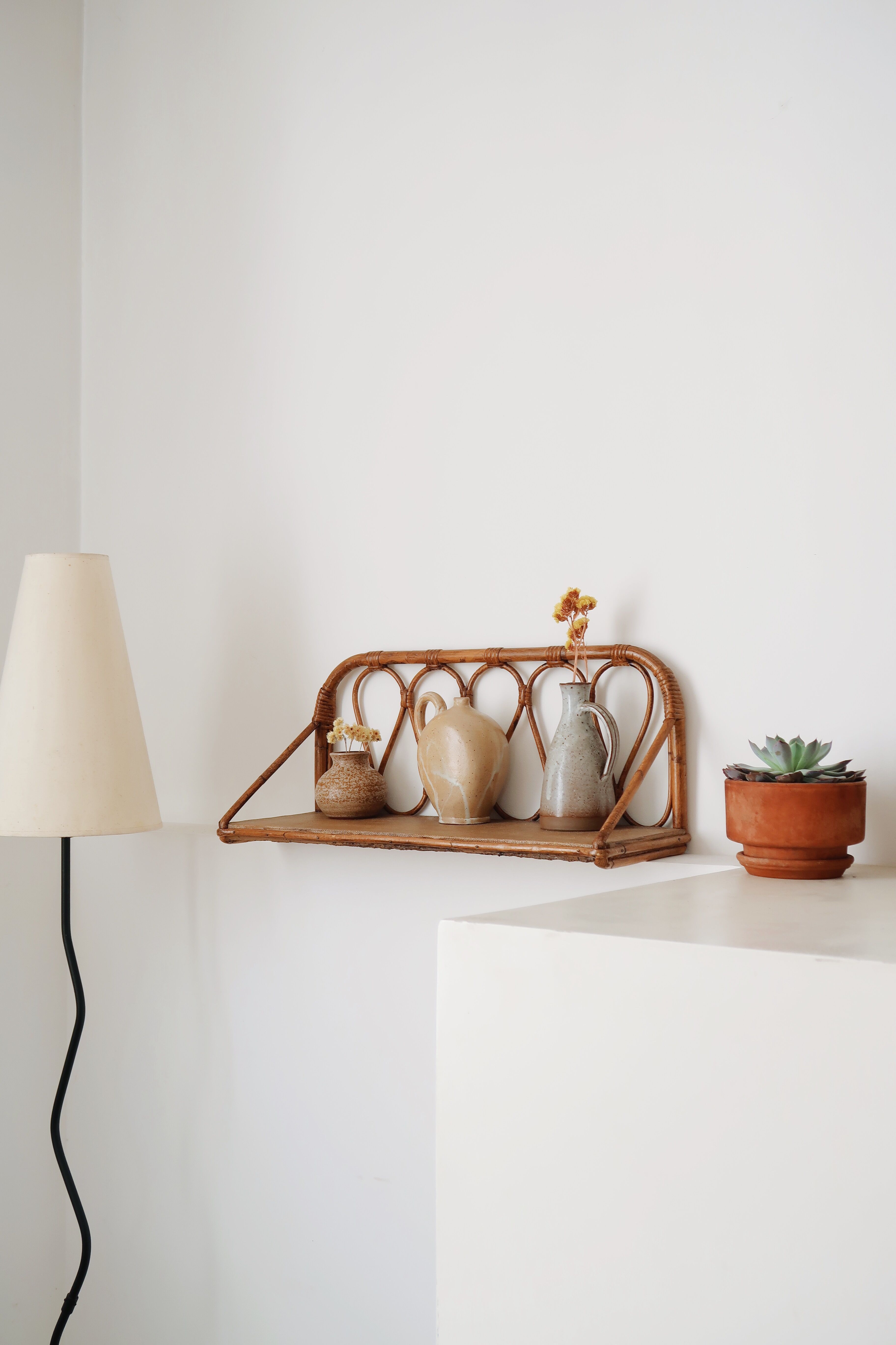 Pair of rattan wall shelves