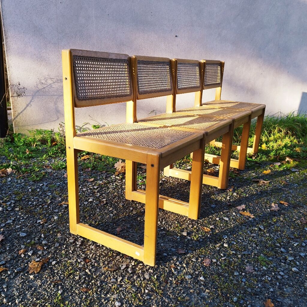 Four trendy tanned wooden chairs