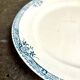 Longchamp round dish in iron earth, "Lily" service