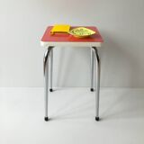 Stool in pinkish red formica