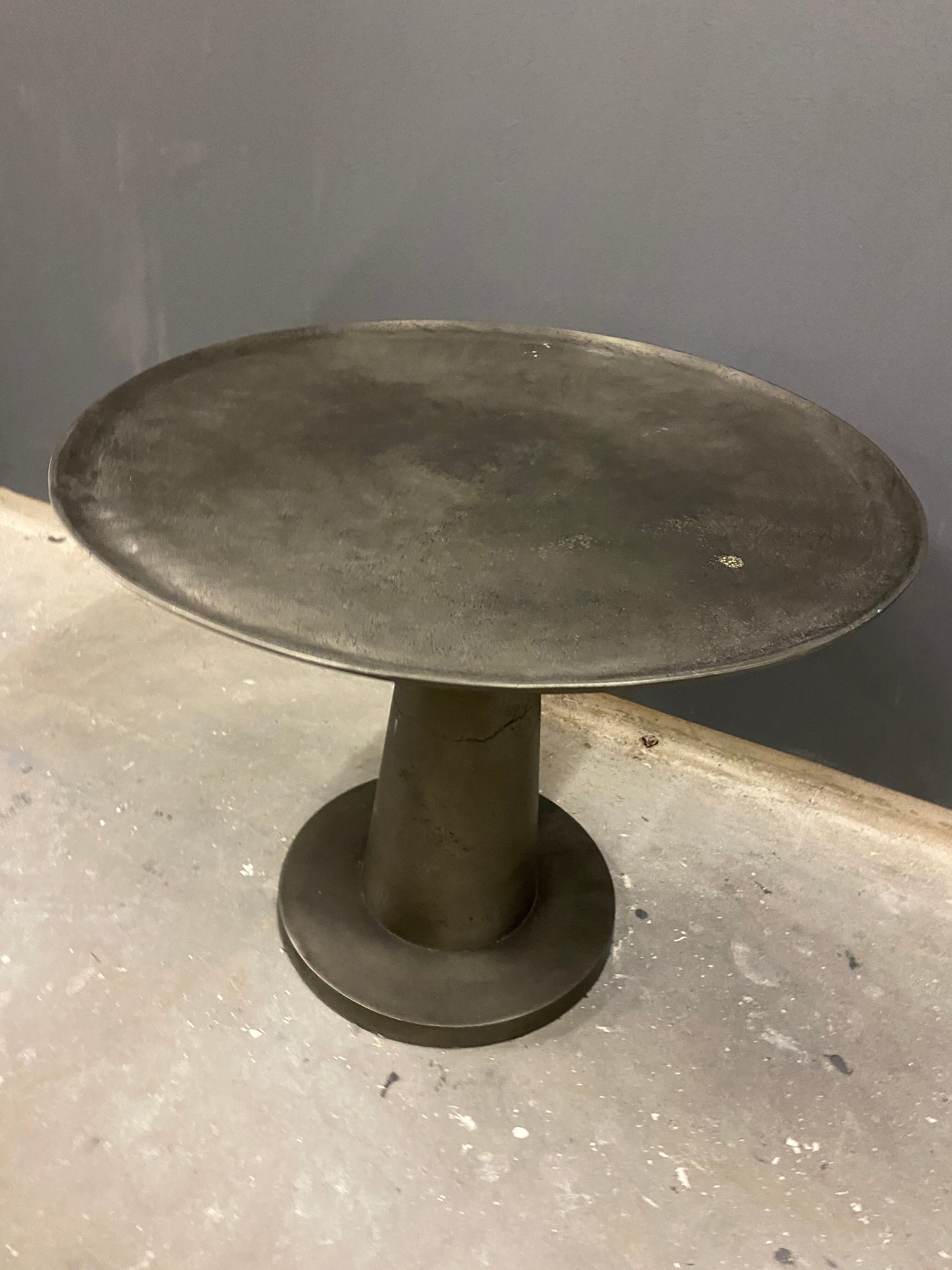 Industrial grey metal round table