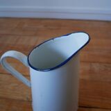 White enamelled metal broc