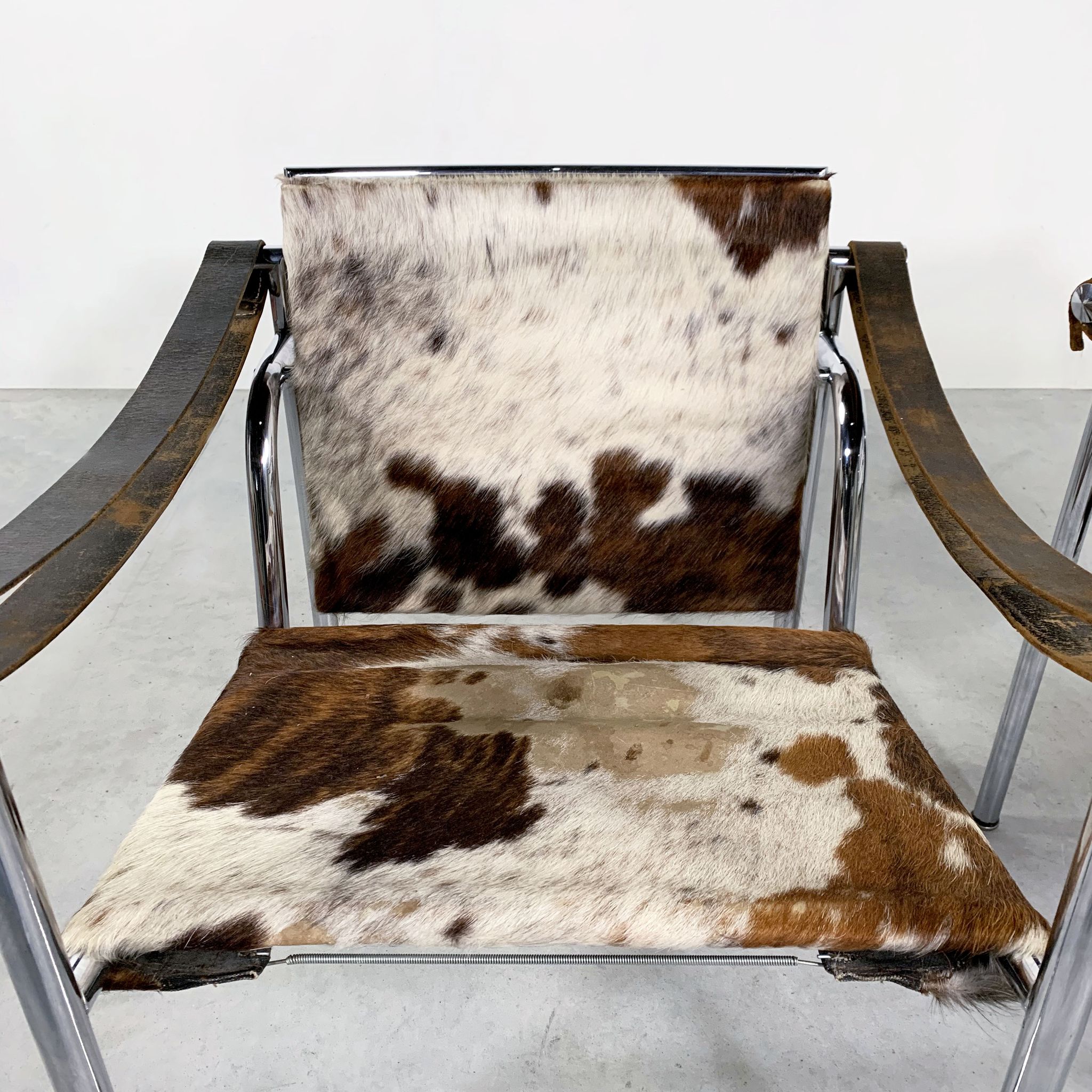 Pair of LC1 cow skin chairs by Le Corbusier for Cassina 1970