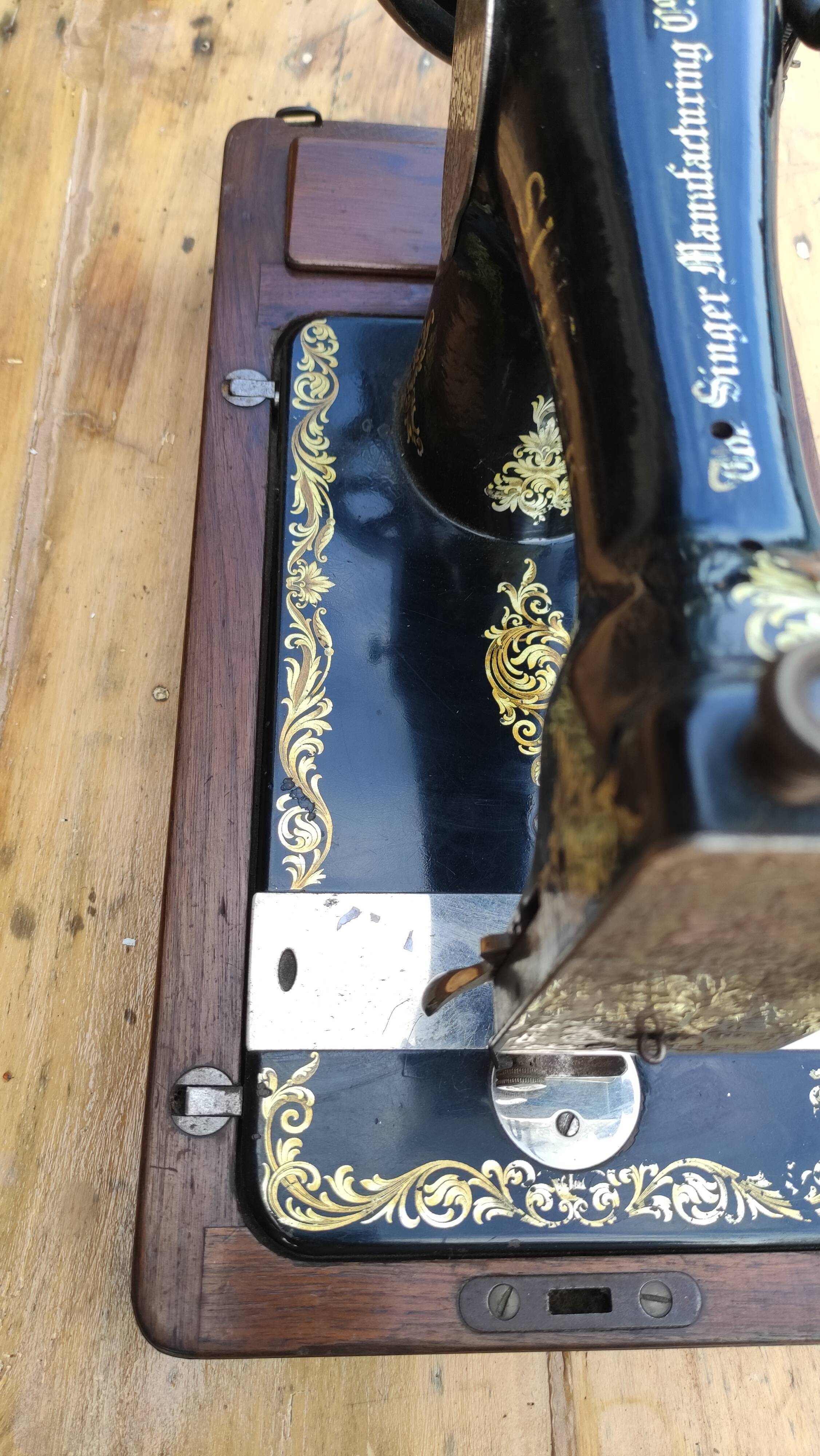 Old Singer sewing machine on its original base