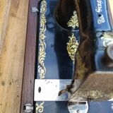 Old Singer sewing machine on its original base