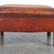 Leather ottoman in classic English style finished with decorative nails