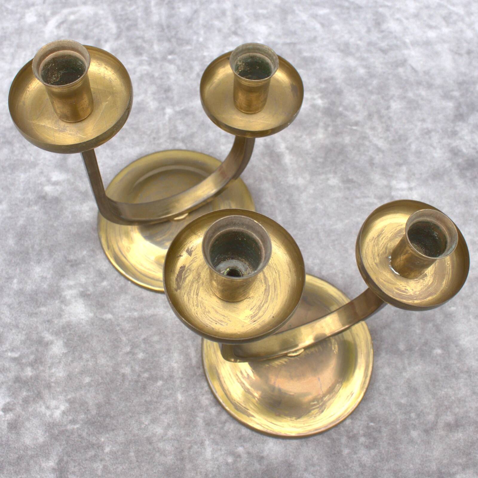 A beautiful pair of antique French Art Deco brass candlesticks