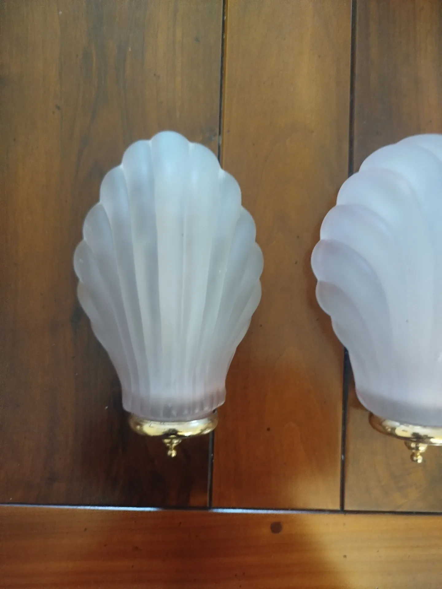 Pair of Art Deco shell wall sconces in frosted glass and brass.