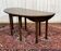 Drop-leaf English table in mahogany called Gateleg.