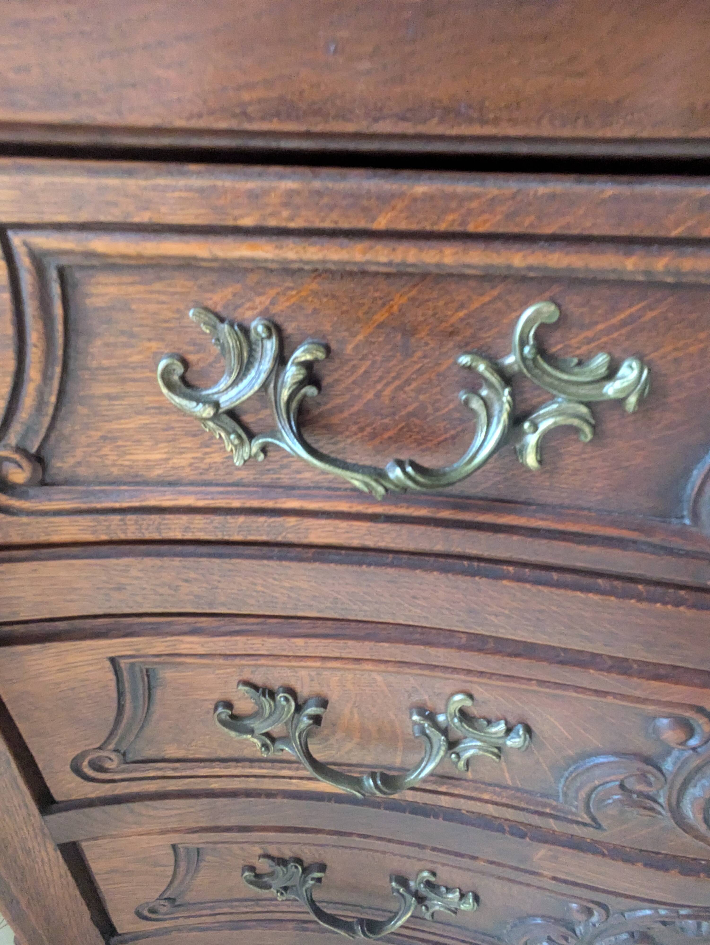 Antique corner cabinet in Louis XV style, topped with a marble surface.