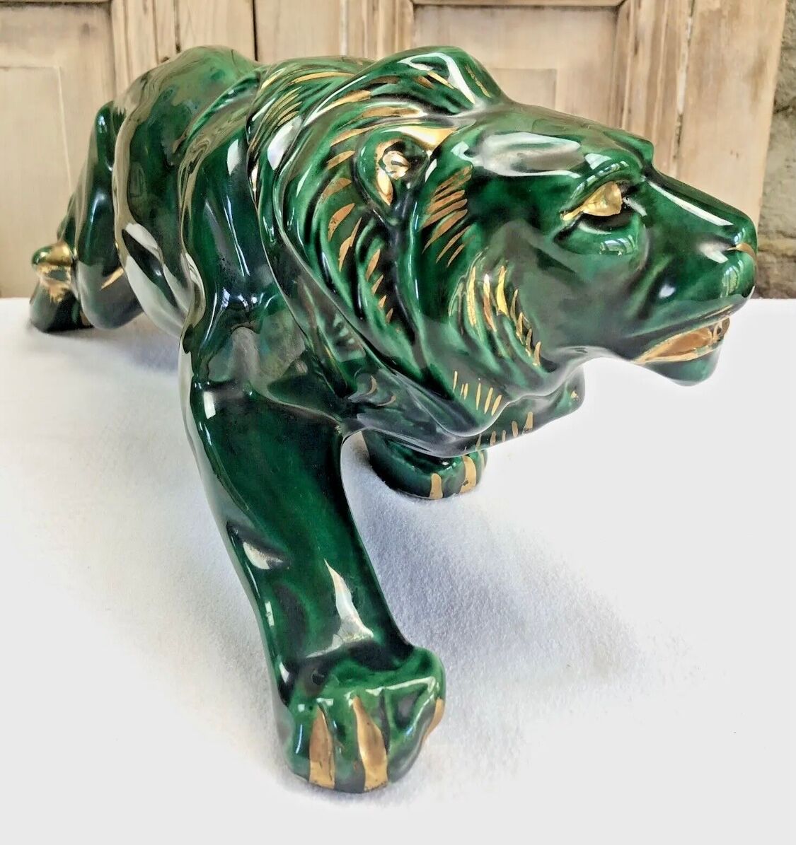 Art Deco lion statue cracked St Clement
