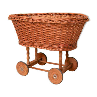 Vintage cradle in rattan doll