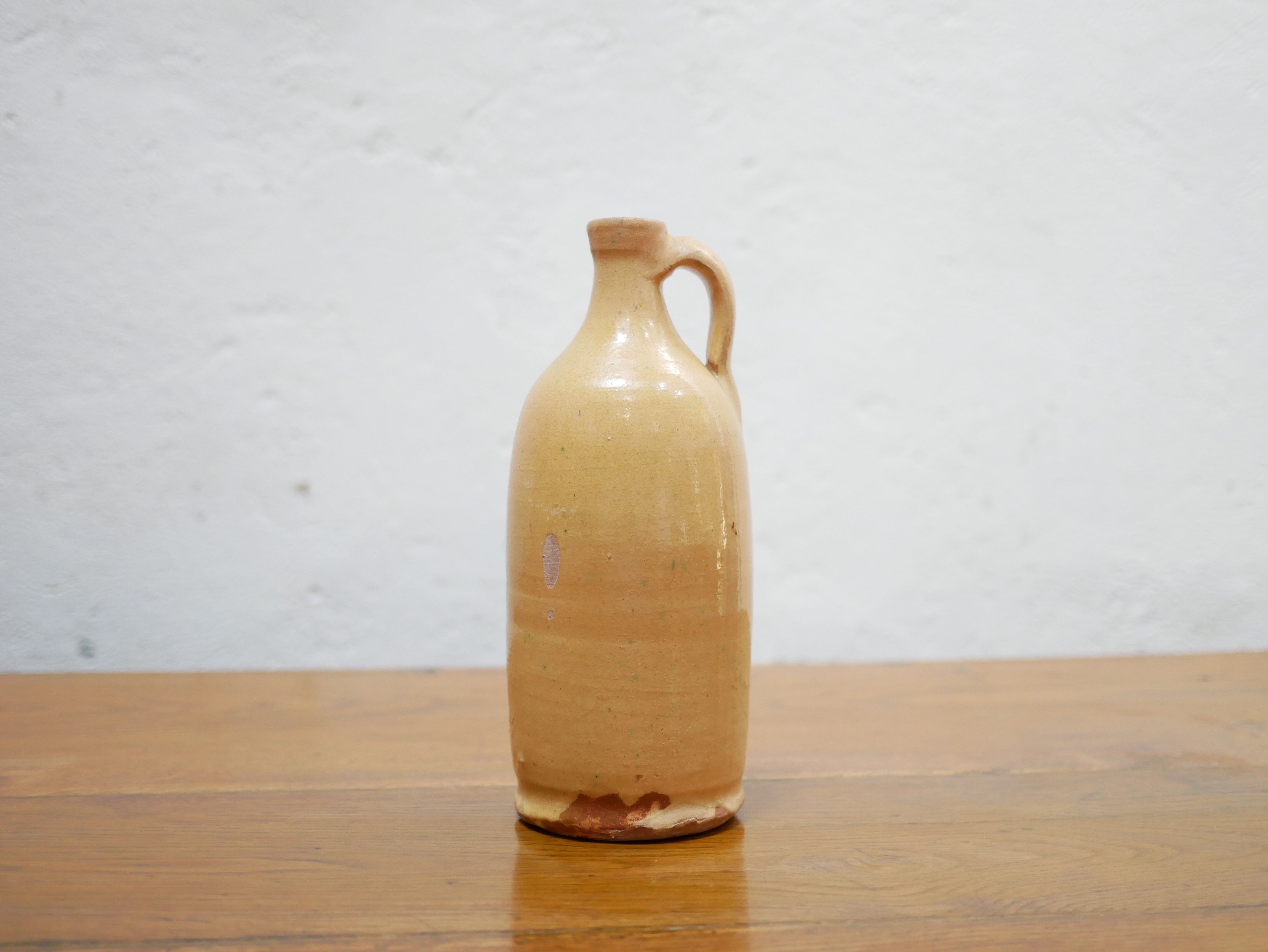 Vintage glazed terracotta bottle
