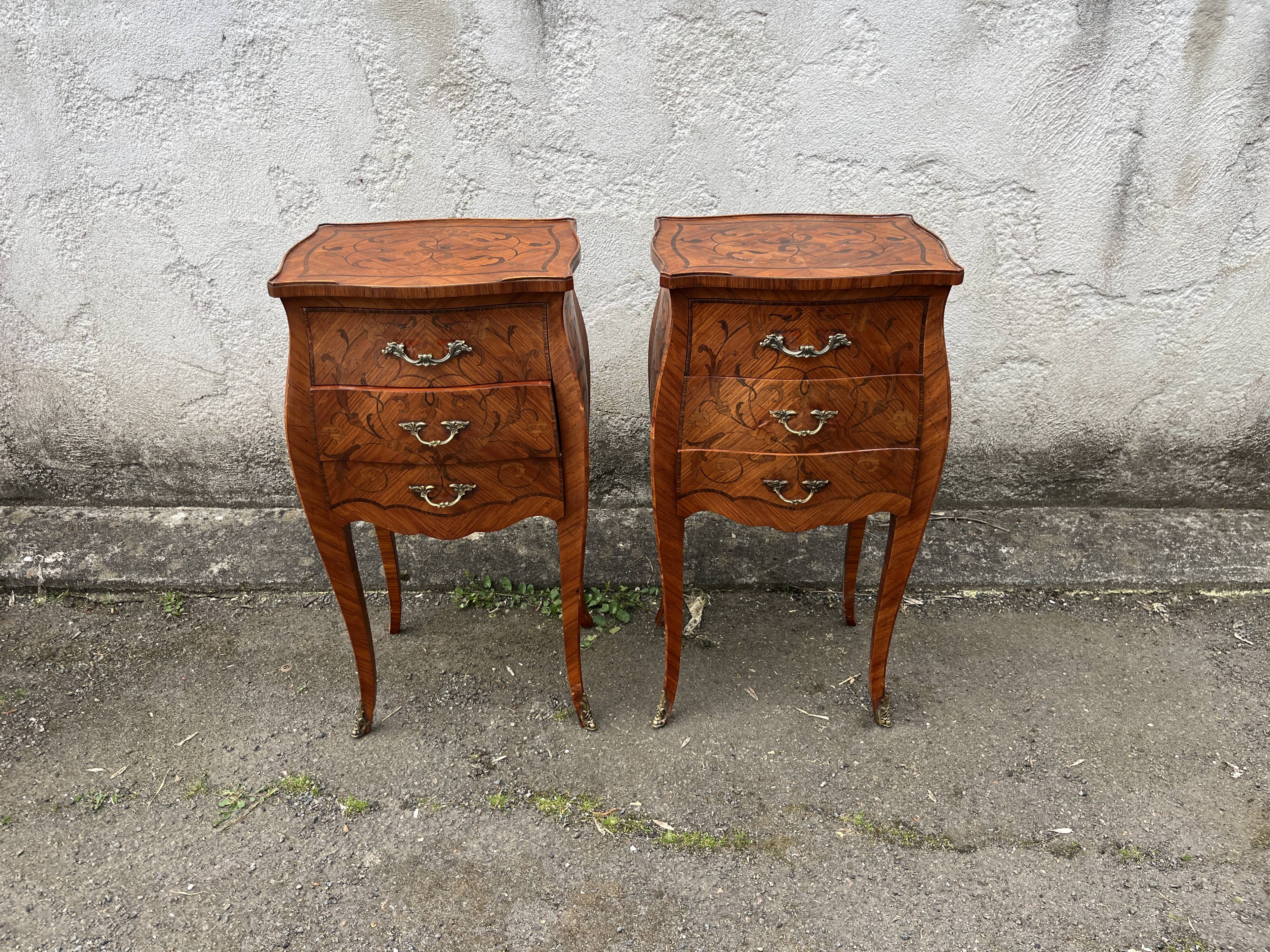 Pair of bedside tables with bombé shape, marquetry, and bronze in Louis XV style.