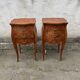 Pair of bedside tables with bombé shape, marquetry, and bronze in Louis XV style.