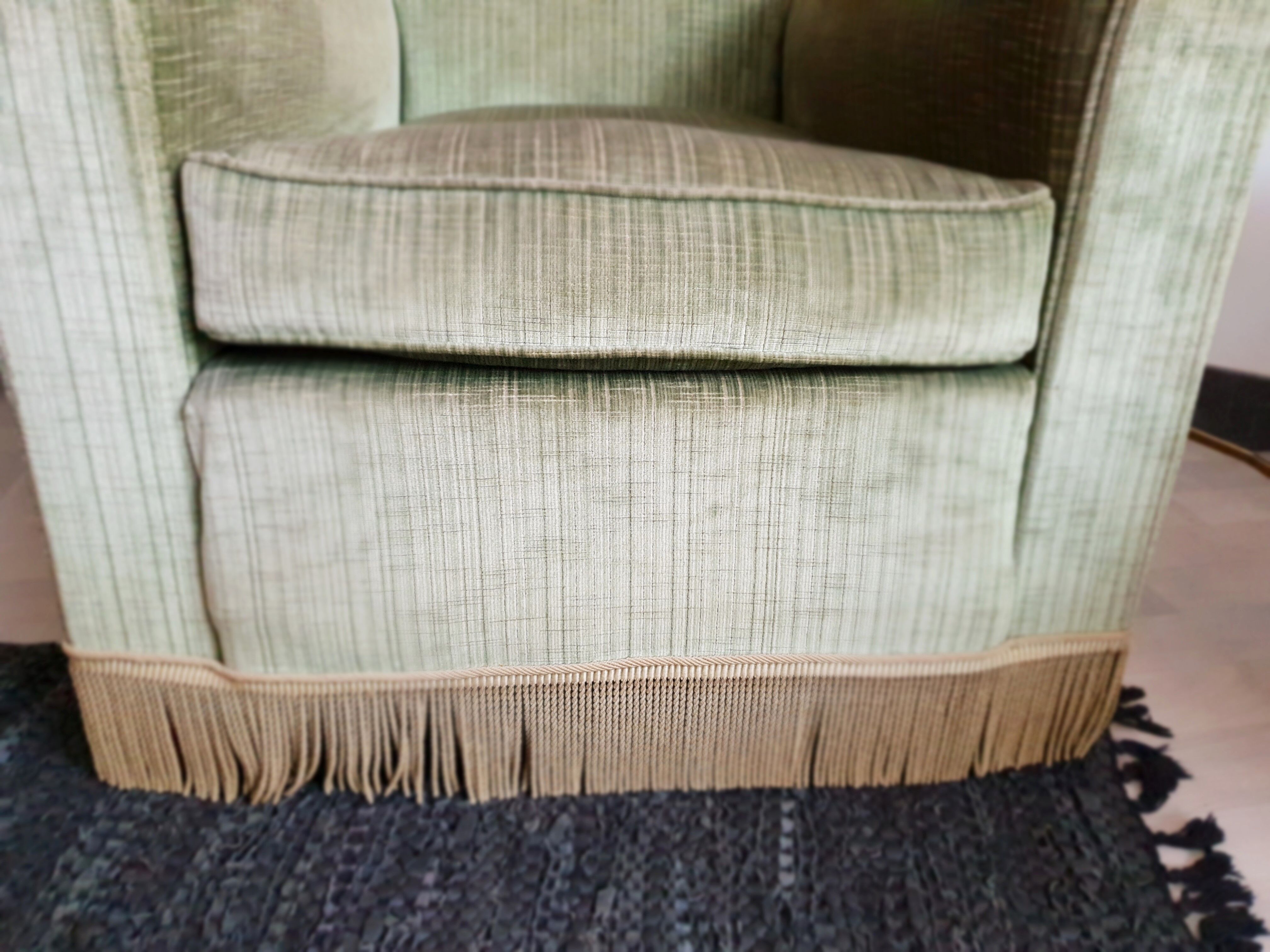 Fringed velvet armchair