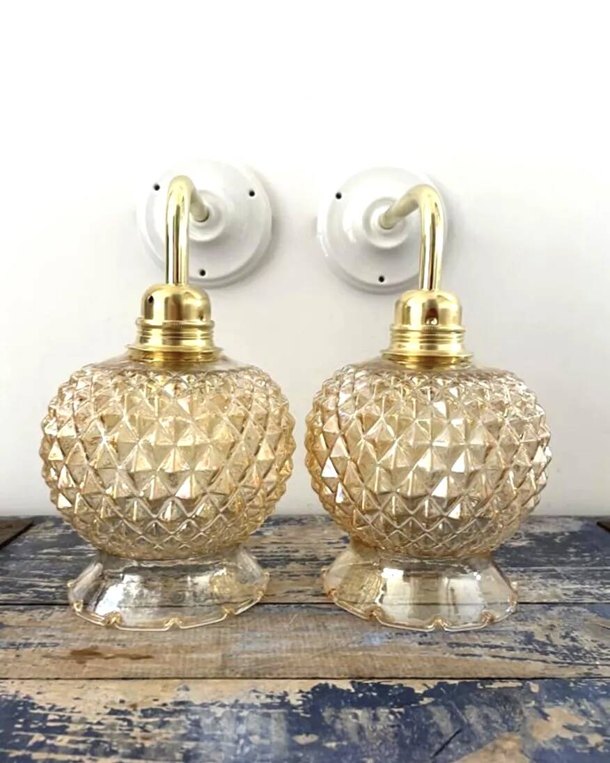 Pair of golden globe wall lights