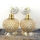 Pair of golden globe wall lights