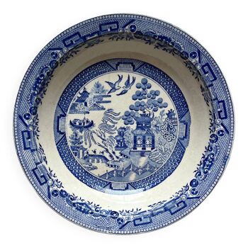 Plat creux en terre de fer décor japonisant bleu