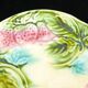 Plate in slurry with strawberry decoration and strawberry leaf
