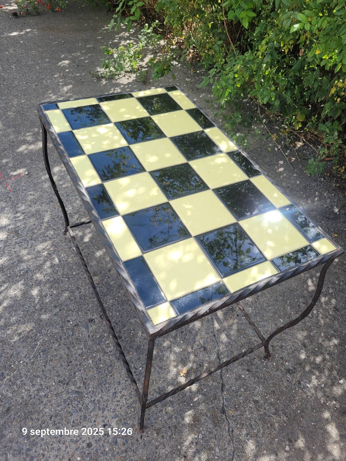 Coffee table with tiled and wrought iron finish