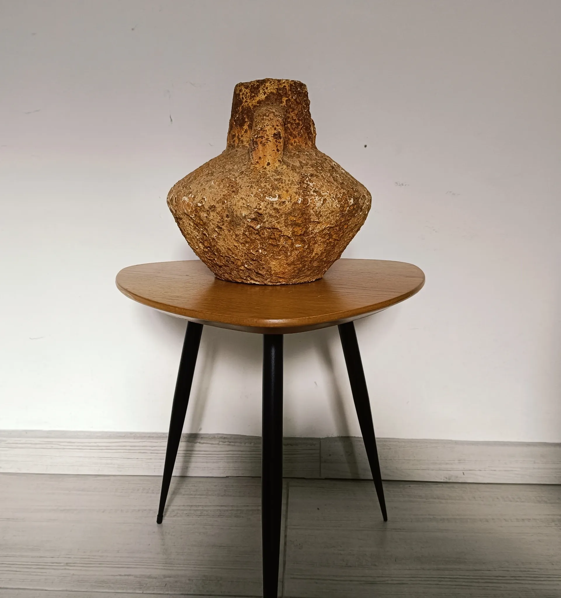 Textured terracotta vase in wabi-sabi style