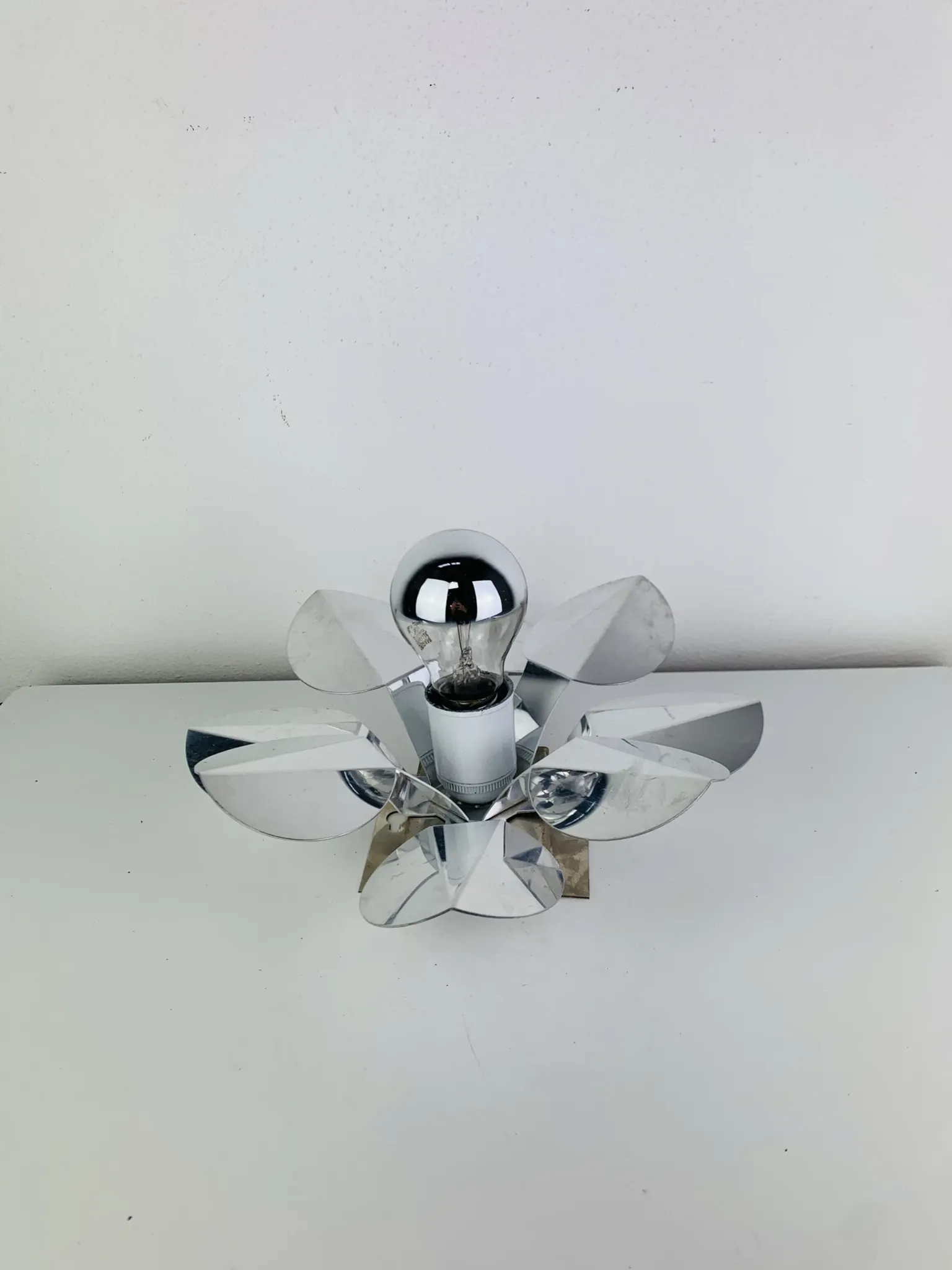 Space Age chrome flower wall light from the 1960s.