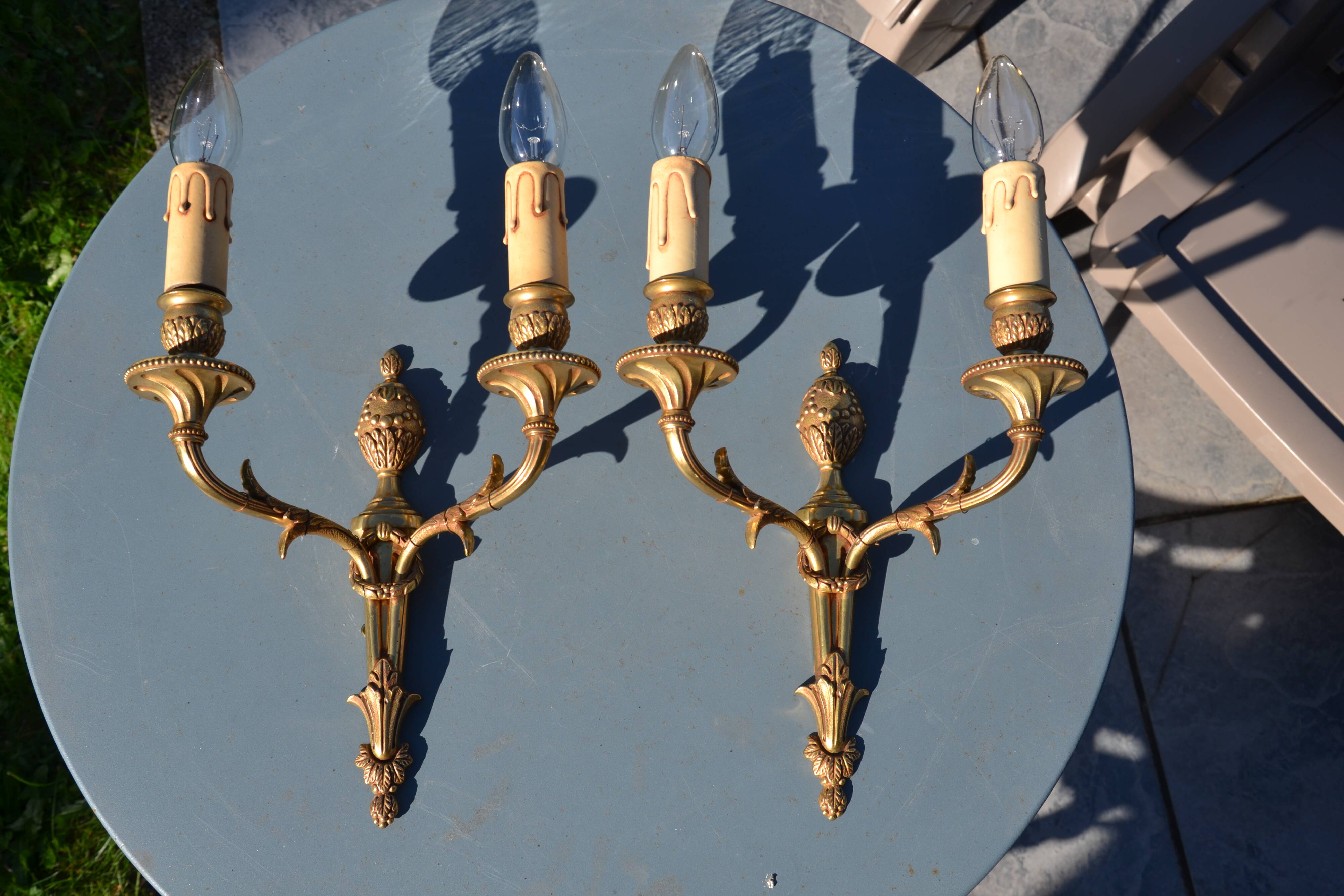 2 sculpted bronze wall lights