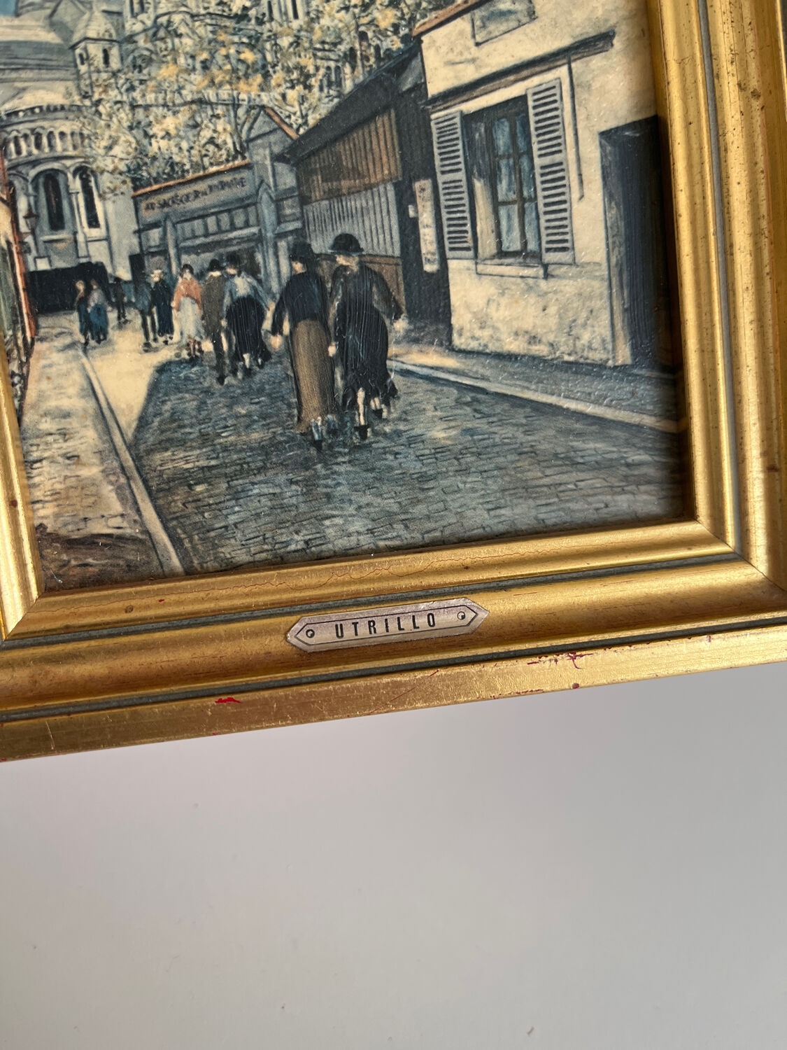 Reproduction of a painting of a walk in the city center by Maurice Trillon