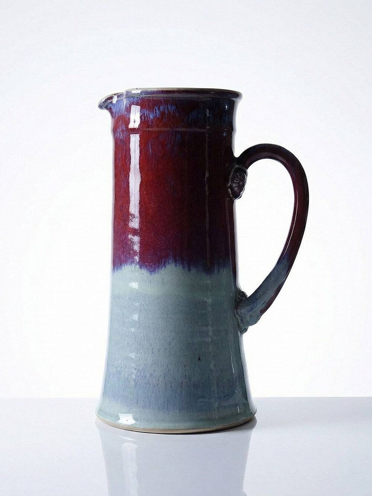 Large artistic stoneware vase by Lévéjac Michel Goldstyn, with flamed oxblood glaze.