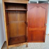 Louis XV rustic bonnetière in solid cherry wood, late 19th to early 20th century.