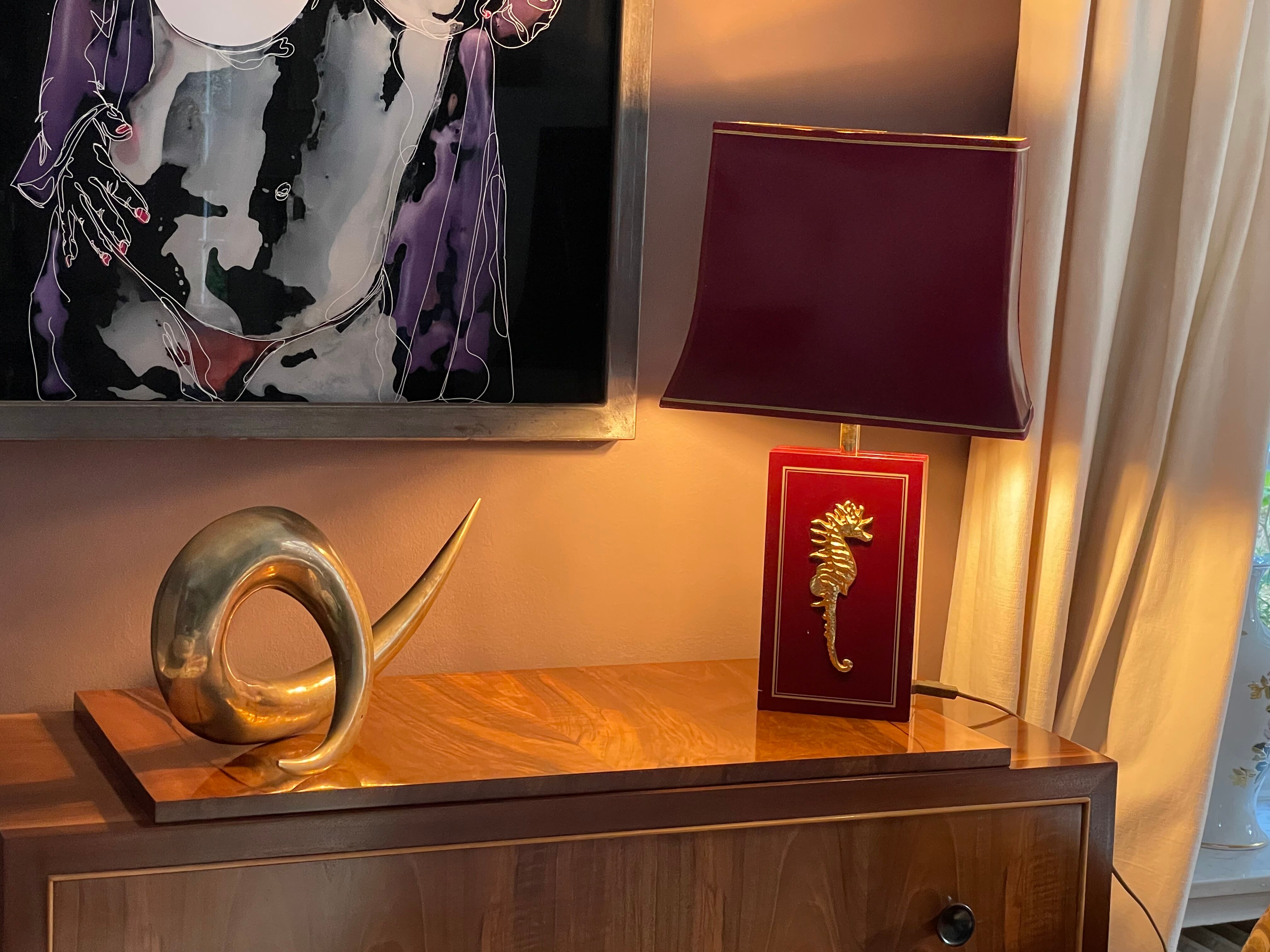 Pair of table lamps in Bordeaux lacquered wood and brass seahorse