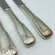 12 silver metal knives.