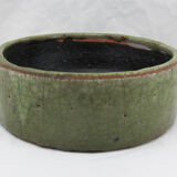 Bowl or empty pocket in cracked green sandstone varnish raku