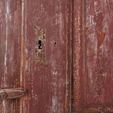Rustic Parisian cabinet in pine wood with old burgundy paint layers, ca. 18