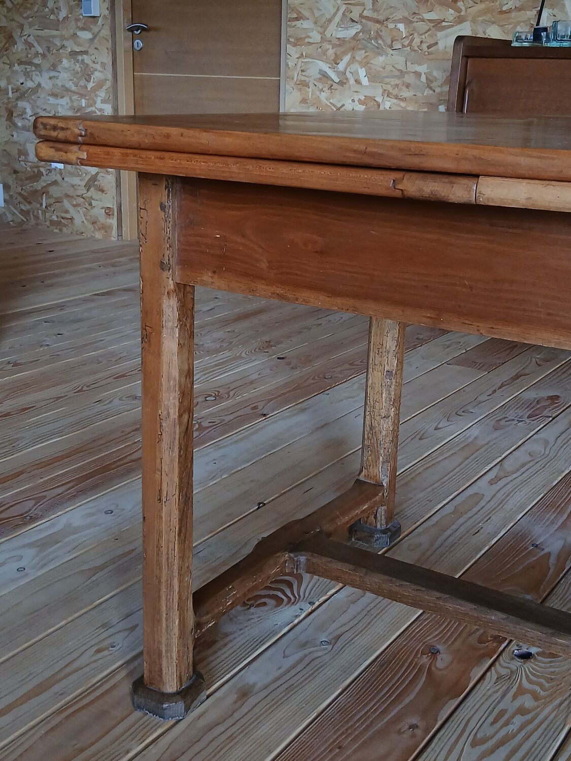 Elm farmhouse table with extensions for 6 to 10 people.