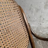 Warm walnut bentwood and cane child's rocking chair early 20th-century