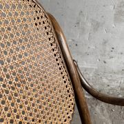 Warm walnut bentwood and cane child's rocking chair early 20th-century