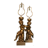 Deux enfants en bois sculpté doré, lampes de table