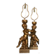 Two carved wooden children, table lamps.