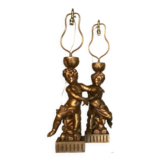 Two carved wooden children, table lamps.