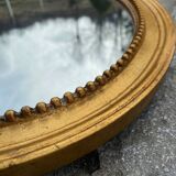 Antique gilded oval mirror