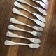 10 mismatched fish knives, silver metal