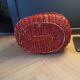 Red painted rattan basket