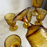 Six stemmed glasses in amber-colored molded glass