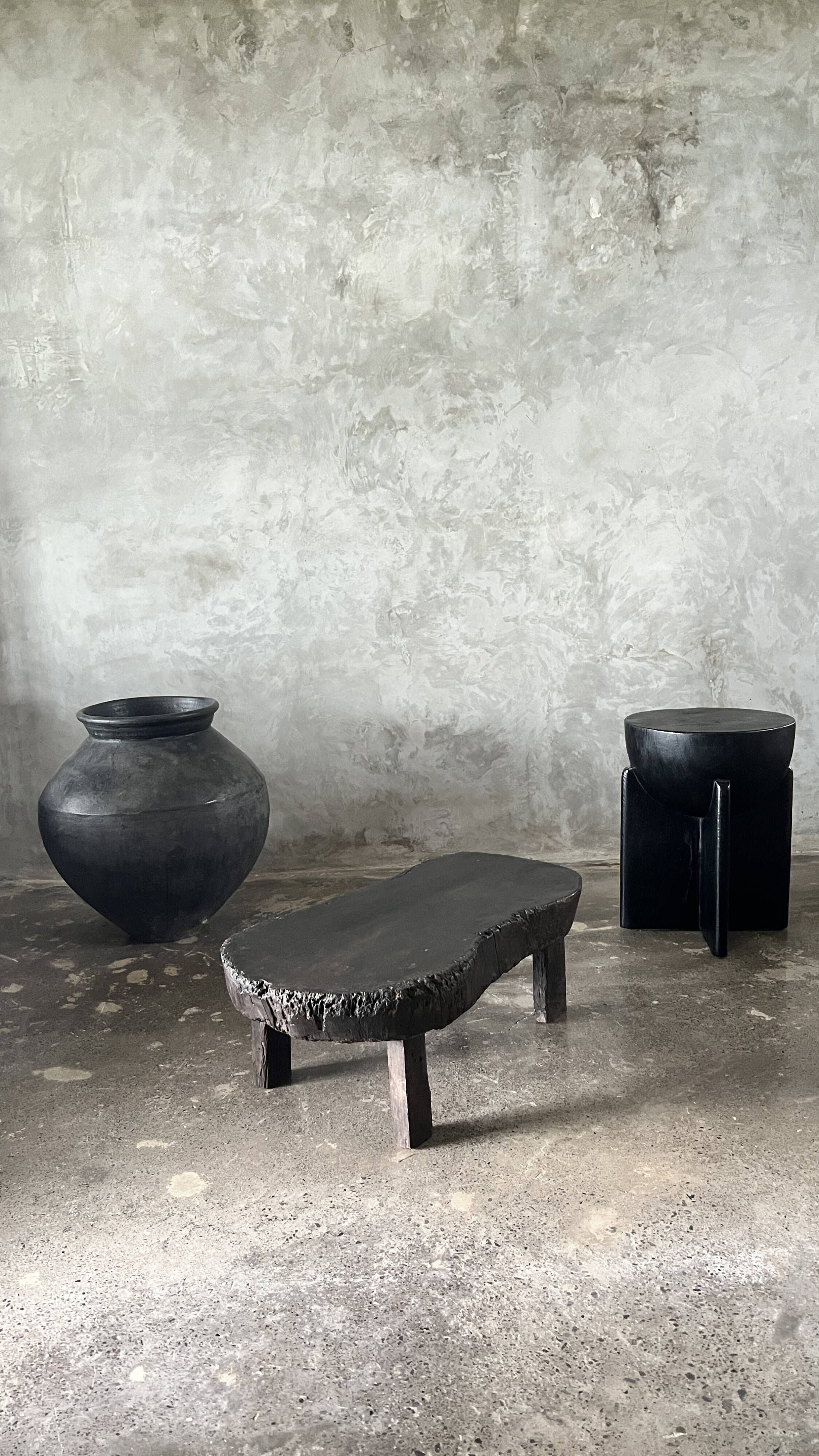 Small old Asian wooden coffee table in Japanese style, kidney-shaped top
