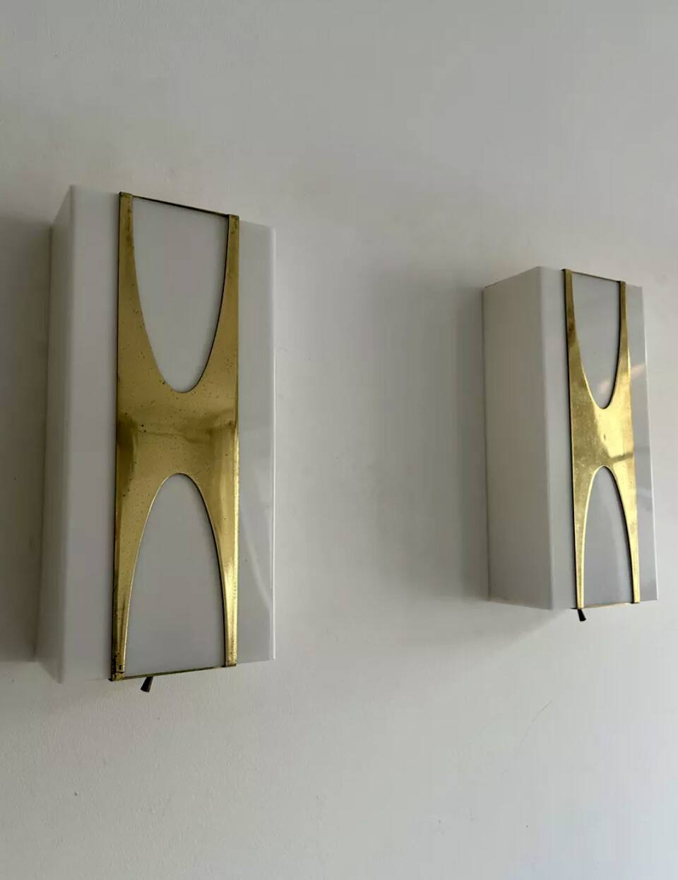 Pair of Loewy wall lights for Hilton, brass and Perspex, France 1965