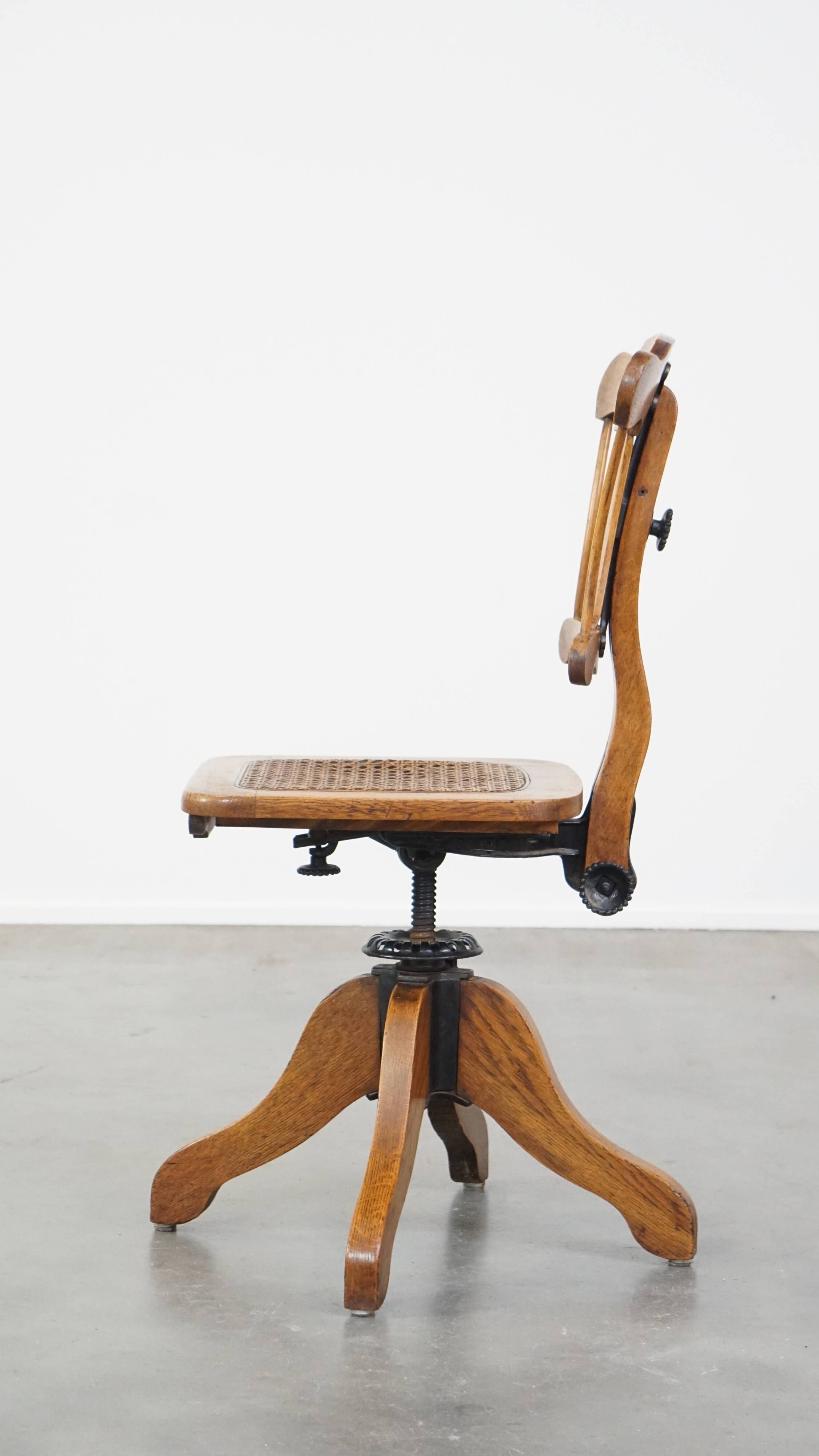 Antique late 19th century English office chair with reclining backrest and height adjustable